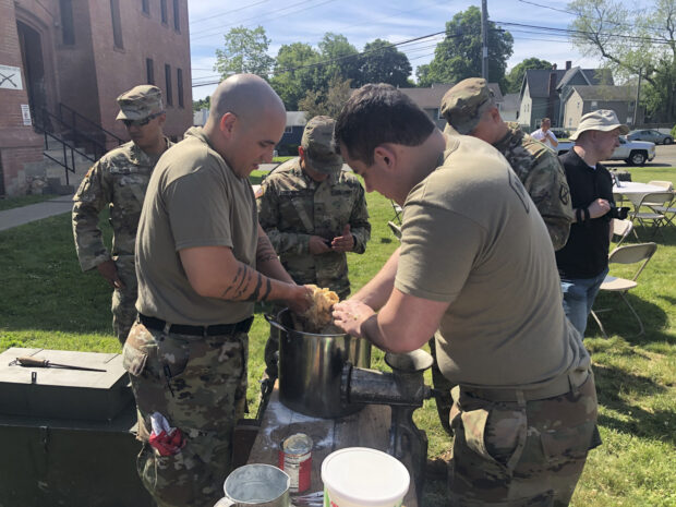 Soldiers making donuts Soldiers making donuts on a WWI rolling field kitchen.