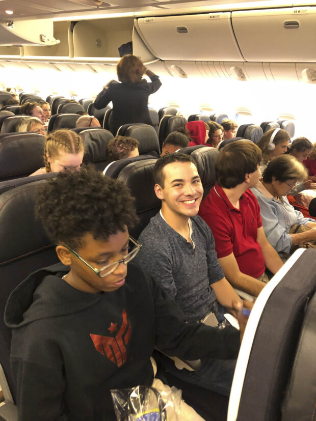 Settling in on Air France Flight 333 headed to Paris! Pictured: Tasha McClain, Thomas Mulholland, Joe Viski