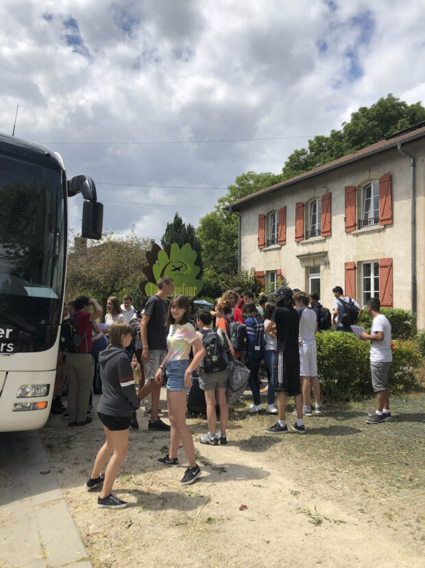 French and American students mingle after getting off the bus at the Carrefour des Jeunes in Beaumont, France.
